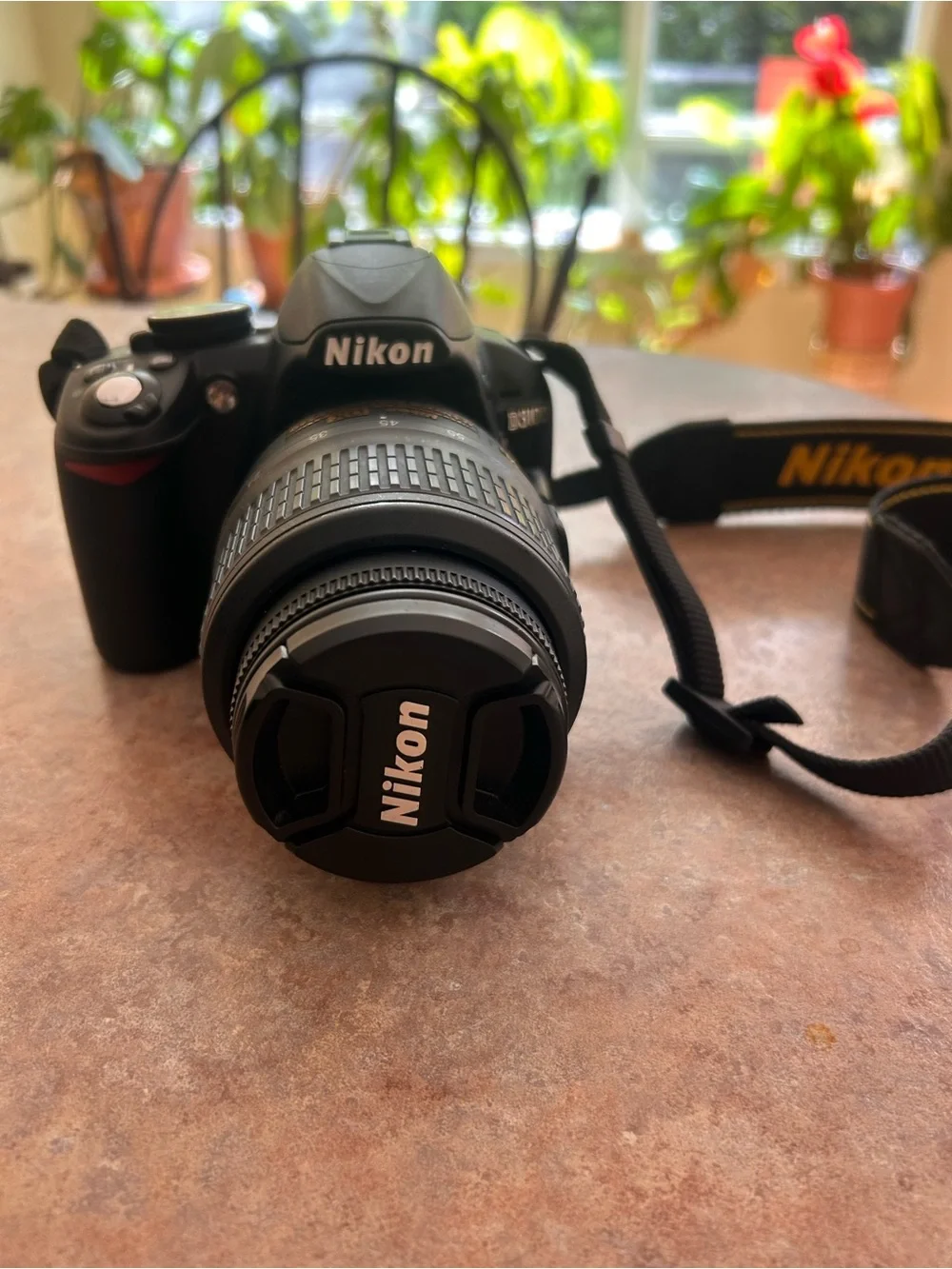 Nikon Black 3100 DSLR Camera with Zoom Lens and Branded Strap